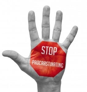 Stop Procrastinating Sign Painted, Open Hand Raised.